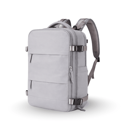 Grey rectangular travel backpack with multiple zip pockets and adjustable shoulder straps.