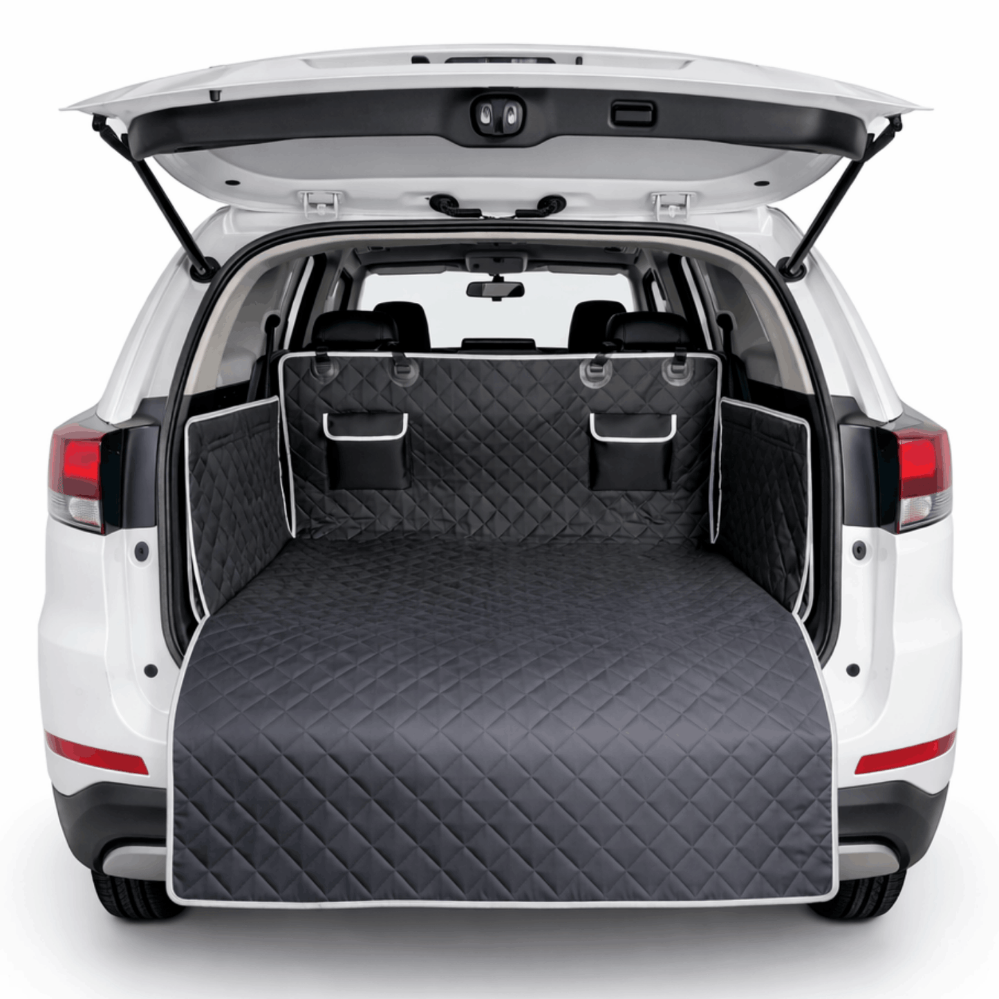 Black quilted dog blanket for the car trunk with side flaps and protective edge.