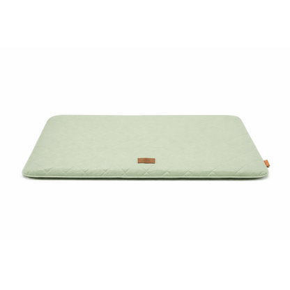 Green quilted dog seat cushion for car and home with rectangular shape for comfortable resting.