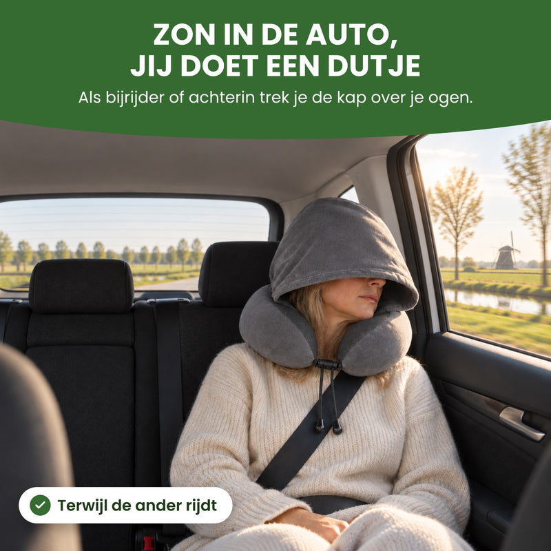 Woman in a car's back seat, the hood of the gray NeckEase pillow over her eyes, sun at the window: take a nap, even with the sun streaming in