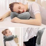 DreamRest™ rice neck pillow used for sleeping on the table, in a chair, and as back support while traveling.