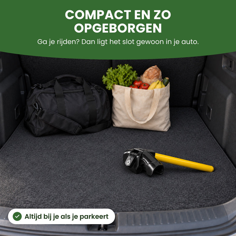 The yellow and black steering wheel lock in a corner of the trunk, next to a gym bag and a grocery bag: compact and easy to store