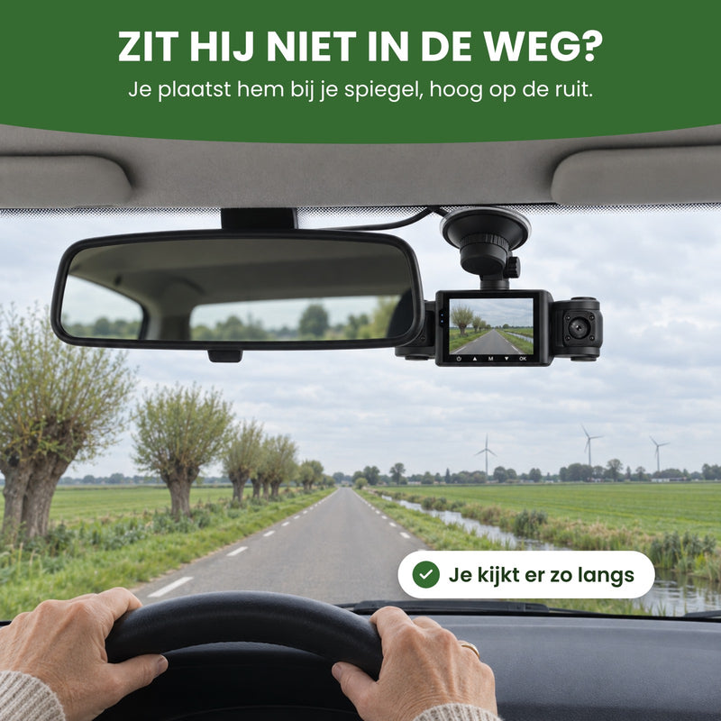 VisionEdge 360 dashcam partly behind the rear-view mirror, screen on, above an open country road: you see right past it