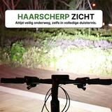 Bicycle with activated Voltura LED lamp brightly illuminates a path in the dark for maximum visibility.