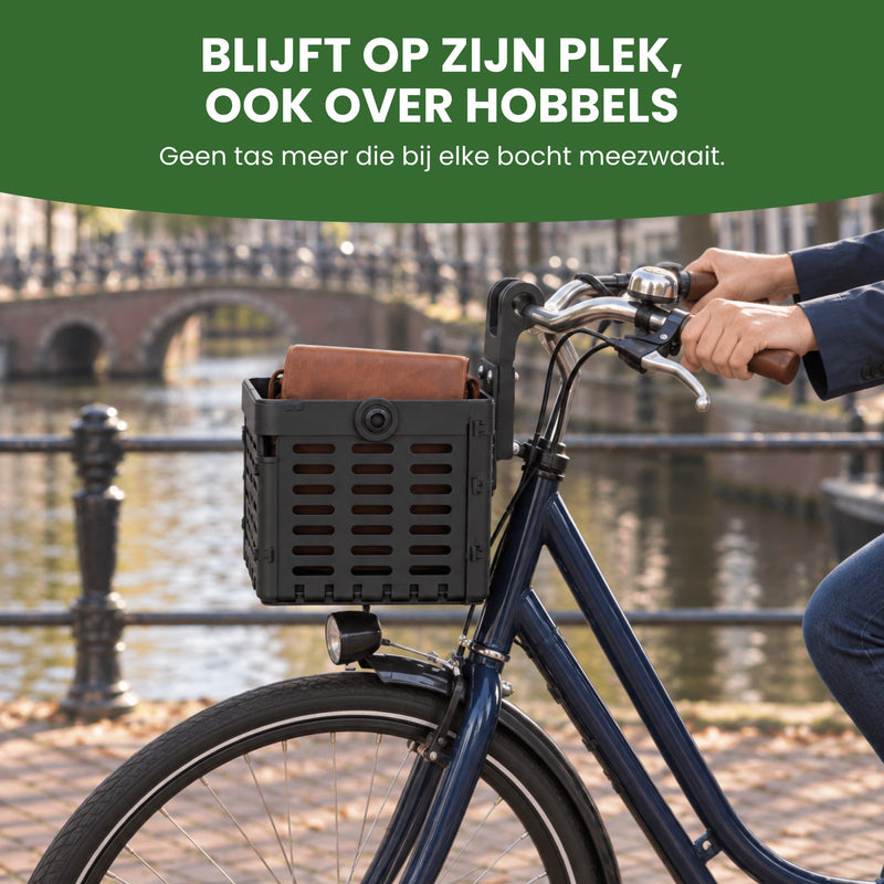 Zyro bike basket with a brown leather bag under the handlebars of a city bike on a park path: stays put, even over bumps